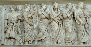 This sculpture engraved into the Ara Pacis shows a procession of priests. When a Roman was acting as a priest he would pull the folds of the toga over his head.
